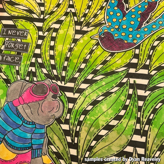 one of the samples created by Dyan Reaveley featuring Churchill the dog, the bluebird, leaf stencil, pens, Ledger journal, Dylusions inks, and Dyamond Dusts.