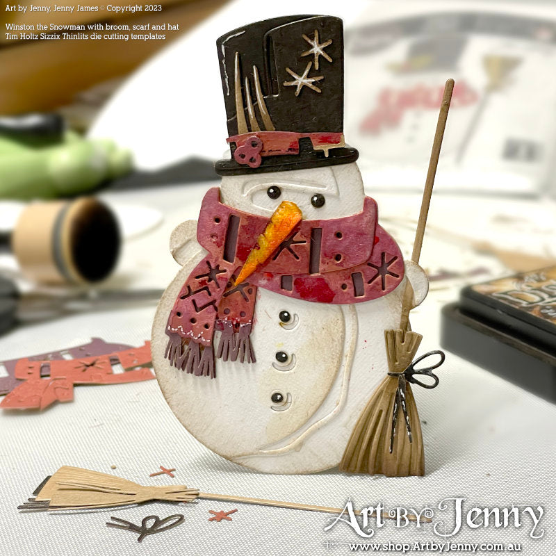 Winston ... Thinlits Colorize Die Cutting Templates by Tim Holtz, made by Sizzix (no.665569). 16 (sixteen) templates to cut out all the layers and pieces to create a wonderful friendly snowman. 
Winston as shown here has a woolly scarf, top hat with sparkles, a witch's style broom (what I call a proper broom with bristles and tied onto the stick, handle), 3 buttons and carrot for his nose (as one does). Size complete, 7cm x 12cm.