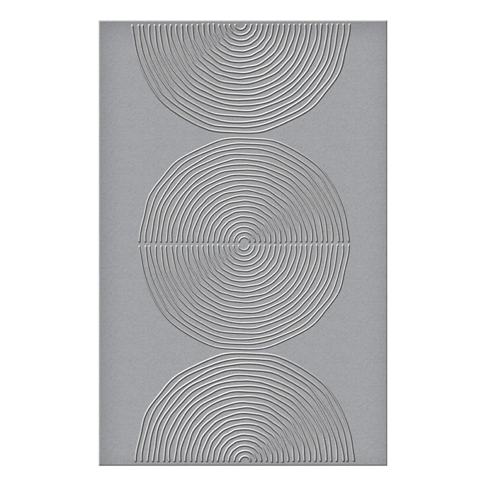 Lined Circles - Embossing Folder ... designed by Dina Wakley MEdia. Part of the 'Modern Botanicals' collection made by Spellbinders Paper Arts (no.SES-066). The embossing folder is A5 in size (145mm x 223mm). This wonderful design features one large circle and two half circles (semicircles), each with thin lines, rings, within each of the shapes. It creates a marvellous textured pattern that will compliment almost any creative project. Image of the design.