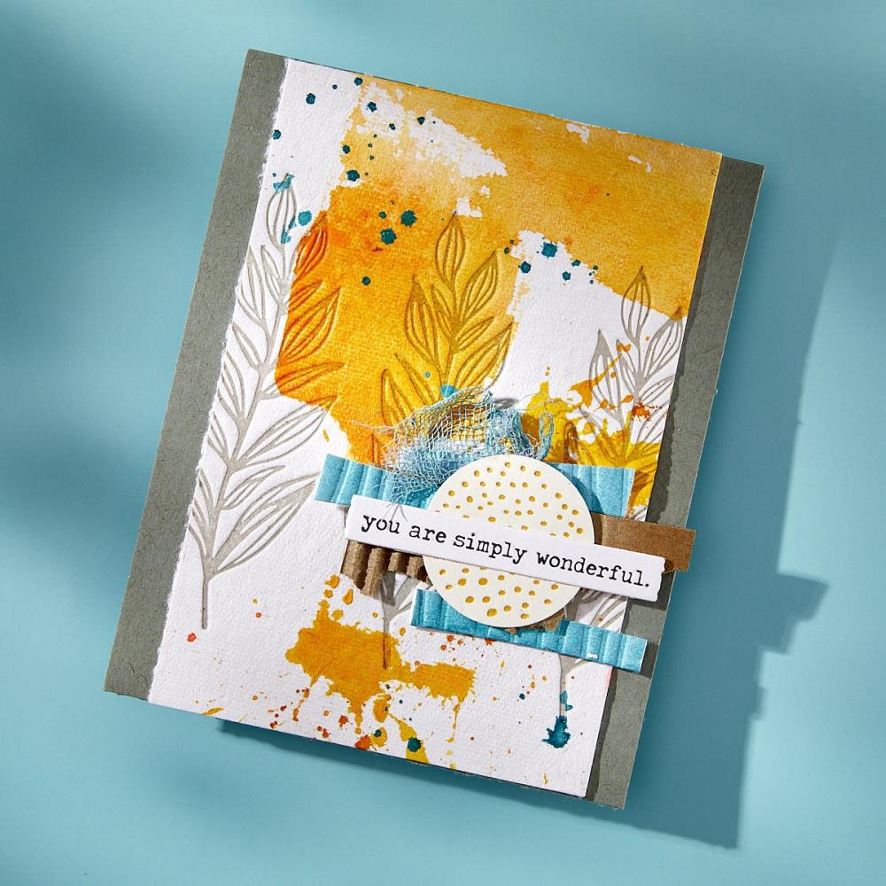 Sample made using the BetterPress Press Plates and Dies designed by Dina Wakley MEdia with Spellbinders. Part of the 'Modern Botanicals' collection made by Spellbinders Paper Arts (no.BPR-027). 
Dina's BetterPress Growing (Modern Botanicals) set includes designs of leaves and lined circles as cutting dies and embossing printing plates to be used together or separately for creating textured dimensional layers in art. Image of a card sample with golds and kraft and layered fibres, textures.