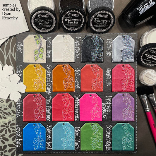 Dyan Reaveley Dylusions Ranger embossing powder examples showing Dyamond Rocks in various colours, with White Linen Dyamond Pebbles in the writing.