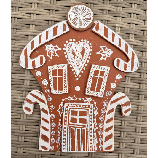 Dyan Reaveley's Dylusions Stampers Anonymous arty crafty example made by Dyan - a gingerbread house made with a Village Cutout Artboard kit using Dylusions red rubber art stamps, white fine embossing powder and a little heat to melt the powder to create a glazed faux enamel finish.