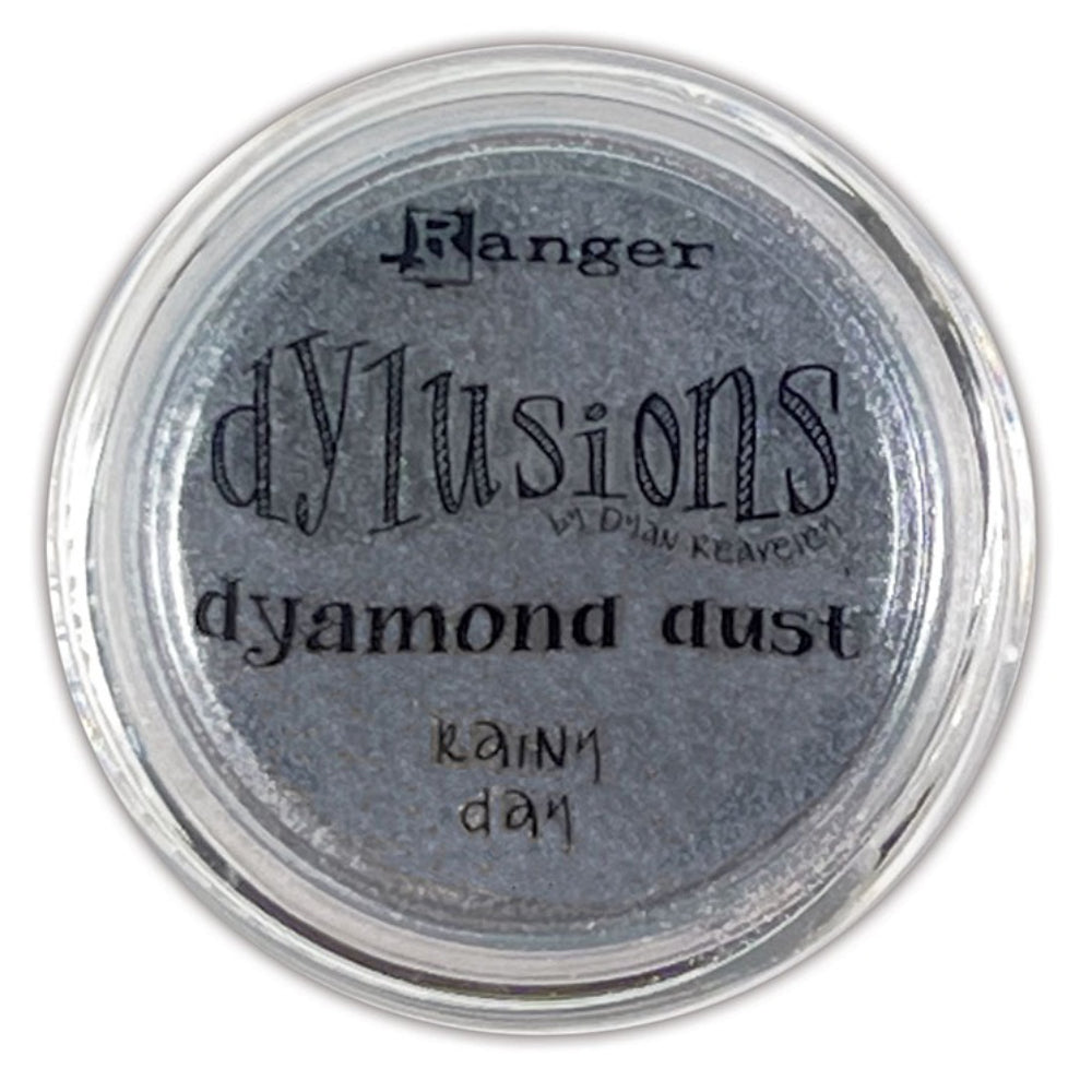 Dyamond Dust ... by Dyan Reaveley's Dylusions and Ranger Ink. Pearl Pigment infused mica powder in vibrant Dylusions colours to add shimmer and enhance artwork. Create beautiful shimmery and colourfully pearlescent effects on book covers, journals, scrapbooks, greeting cards, mixed media, embossed dimensional artwork and more. Photo of Rainy Day (grey).
