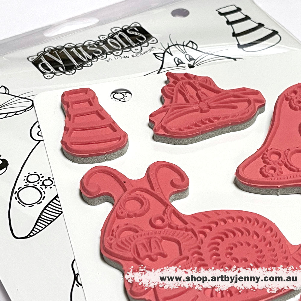 photograph of the Toadstool Tales ... Dylusions Stamp Set (DYR10010). Original designs by Dyan Reaveley, made by Stampers Anonymous out of red rubber mounted on cling foam. Perfect for mixed media, art journaling, scrapbooking, stamping on fabrics, papercrafts. 7 (seven) designs. Designs include a beautiful big toadstool gnome home with stripy ring walls, a tiny attic, round window, wooden door and garden, plus whiskered faces, a cut snail with bow tie, toadstool hat and spare mushroom stalks.