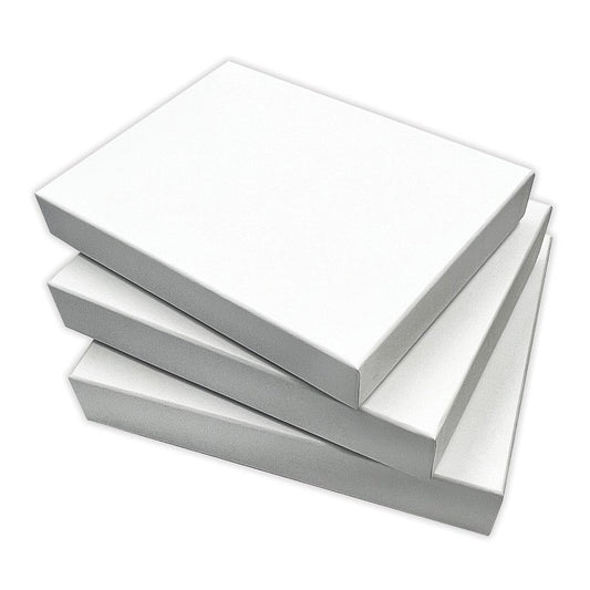 Nesting Boxes - White, 3 Boxes or 6 Trays ... Dyan Reaveley's Dylusions and Ranger.  Dyan's Dylusions Nesting Boxes are a set of 6 (six) trays made of durable white board with reinforced corners which fit perfectly within each other in a stack. Alter and use as storage or gifts for friends and family. Photo of a stack of 3 closed boxes.