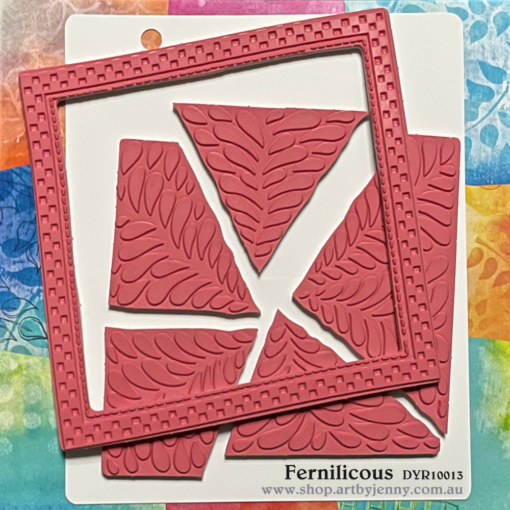 Fernilicious ... rubber stamp set - Dylusions by Dyan Reaveley (DYR10013). 6 (six) designs in one for use in mixed media, art journaling, stamping on fabrics, papercrafts, visual arts of all kinds.&nbsp;&nbsp;Overall size is 6.5 inch square with cutout sections. Six designs in one, precut and ready to go ... a beautiful leafy design that grows from the centre with triangular segments and a square frame. Use as one whole stamp or pull apart to print out each section separately, one at a time.