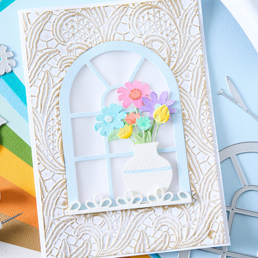 Lacy Leaves - Large, A5 (6in x 8.5in) ... 3D Textured Impressions Embossing Folder ... by Eileen Hull and Sizzix (no.666977). Create dimensional embossed texture for cards, journal pages, bookmaking, book covers, papercrafts and visual creative arts. This A5 (6" x 8 1/2", 15cm x 21.5cm) large embossing folder has a gorgeous background pattern which looks like a realistic lacework panel of petals, foliage and lines. Image of an example, white greeting card.