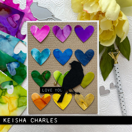 heartfelt greeting card made by Keisha Charles for Tim Holtz - using the from the Vault Thinlits Die Cutting Templates by Tim Holtz, made by Sizzix (no.666566). These designs cut out three bird silhouettes (garden variety, sparrows), a branch, feather and trio of hearts. Add these versatile designs to greeting cards, tags, off the page displays, cards, scrapbook pages, art journaling, all kinds of visual arts and papercrafts.