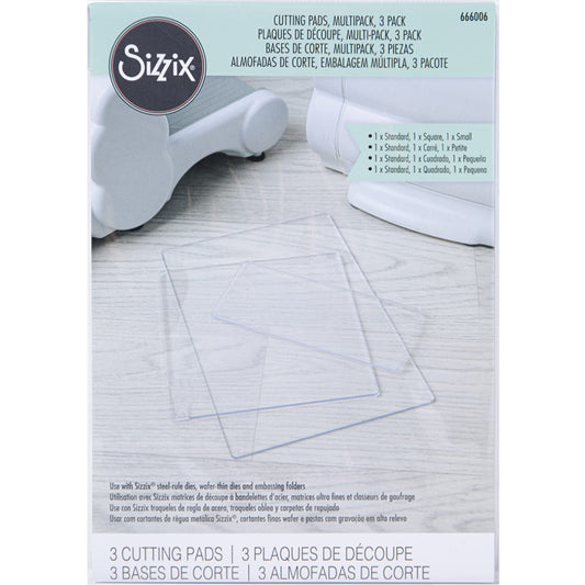 Clear Cutting Pads, Multipack of 3 Sizes ... by Sizzix. Clear plastic cutting plates to use with Sizzix steel-rule dies, wafer-thin dies and embossing folders. Sizes approx rectangle 8 7/8" x 6 1/8", square 6 1/8" x 6 1/8" and small rectangle 2 3/4" x 6 1/8", each is 3mm thick. 
This pack of Sizzix Cutting Pads includes an assortment of lengths to use in your die cutting adventures. Photo of the packaging on a white background.