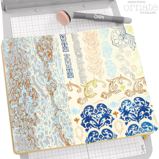 Ornate - Stencils and Stamps ... Sizzix Studio Mixed Media Kit ... by Vic Hollins and Sizzix. Layering art stencils and clear acrylic stamps to use for mixed media, papercrafts, art journaling, visual arts of all kinds. The stamp designs in this set includes beautiful detailed flourishes, floral elements, leafy pattens, birds, a small oval frame, edging and more. A total of 14 stamp designs and 3 stencils. Stencil designs include a pair of rugged abstract stripes and two lacy patterns. Photographic example.