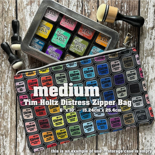 Zipper Bag - Medium ... by Tim Holtz and Ranger - Celebrating 20 Years of Distress with every colour of the Distress Rainbow. Printed canvas storage pouch lined in black water resistant fabric with a silver metal zipper and rectangle shaped pull-tag. Beautiful accessory pouch, Distress storage bag or pencil case. Photo is showing an example of use.