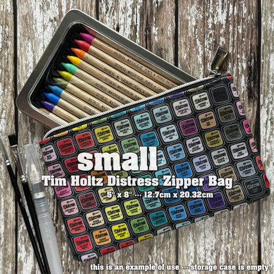 Zipper Bag - Small ... by Tim Holtz and Ranger - Celebrating 20 Years of Distress with every colour of the Distress Rainbow. Printed canvas storage pouch lined in black water resistant fabric with a silver metal zipper and rectangle shaped pull-tag. Beautiful accessory pouch, Distress storage bag or pencil case. Photo is an example of use.