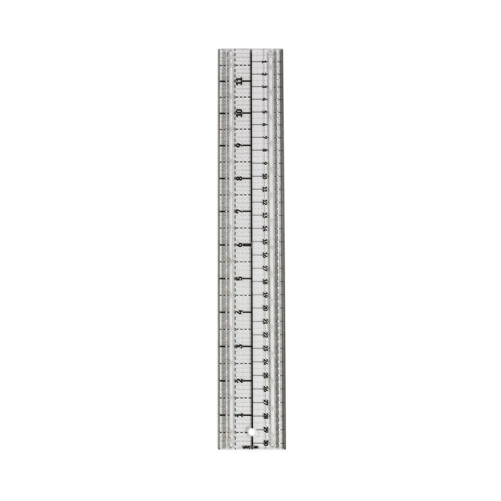Media Ruler ... by Tim Holtz and Tonic Studios. Clear plastic ruler with precise measurements in both metric and imperial, dual steel cutting edges, non-slip backing, 2" wide and 12" long. Photo showing the ruler out of the box.