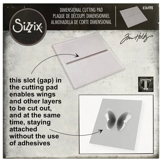 Dimensional Cutting Pad ... by Tim Holtz and Sizzix. Clear plastic cutting plate with a narrow slot used to enable cutting out interactive layers so they stay attached without the use of glues or adhesives. Size 6 1/8" x 6 1/8" pad, 3mm thick. Use this useful and simple device to cut out wings, leaves, tabs, labels and other shapes, and turn them into an interactive element, quickly and easily. Cut out your shapes so they lift off the page and stay put at the same time, no tape or glues required!