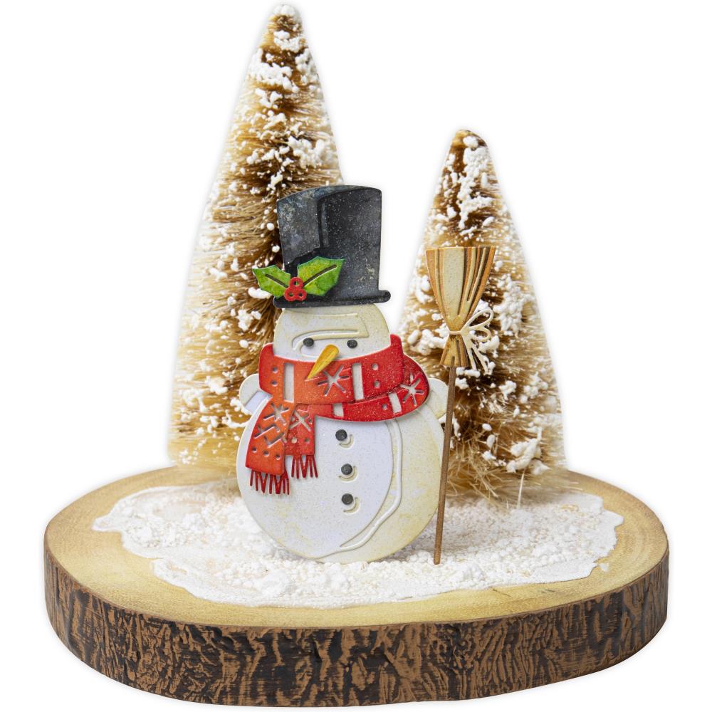 Winston ... Thinlits Colorize Die Cutting Templates by Tim Holtz, made by Sizzix (no.665569). 16 (sixteen) templates to cut out all the layers and pieces to create a wonderful friendly snowman. 
Winston as shown here has a woolly scarf, top hat with holly, a witch's style broom (what I call a proper broom with bristles and tied onto the stick, handle), 3 buttons and carrot for his nose (as one does). Size complete, 7cm x 12cm.