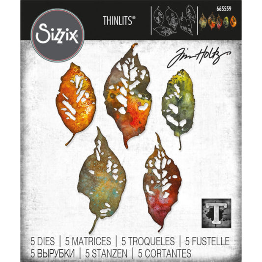 Leaf Fragments - Sizzix Thinlits die cutting templates by Tim Holtz. 5 (five) big beautiful realistic designs to use for die cutting foliage, leaves and petals out of paper, cardstock, lightweight fabric and more for journaling, bookmaking, papercrafts, visual arts and scrapbooking. 5 (five) templates, pieces in total (no.665559). Photo of the packaging with 5 leaves in rustic Autumn colours.