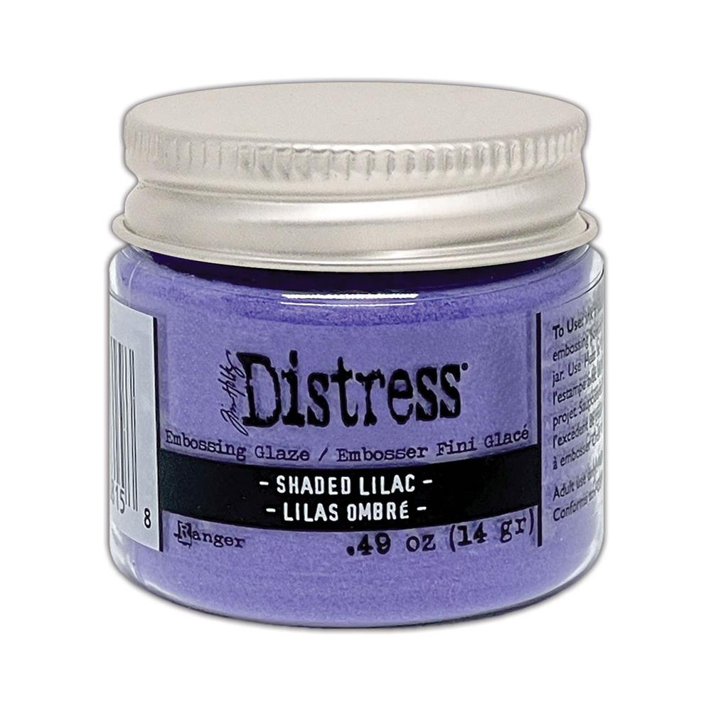 Distress Embossing Glaze by Tim Holtz and Ranger. Distress Embossing Glaze is a fine embossing powder that once melted with a heat tool, creates a colourful tinted semi translucent and slightly textured glazing effect (like a varnish or enamel). Ideal for lettering, stamped images, stenciled areas, abstracts, backgrounds, cardmaking, mixed media, visual arts. Layer over other Distress inks, paints and stains for an unlimited colour palette. Photo of Shaded Lilac.