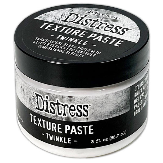 Twinkle - Texture Paste, Translucent, Shimmery and Shiny - Tim Holtz Distress dimensional medium with clear coverage, sparkly glittery highlights and gloss finish, 3fl oz (88.7ml) jar. Made by Ranger. Tim Holtz Distress® Texture Paste Twinkle is a translucent gloss paste with glitter flecks for dimensional effects. The gorgeous Distress Twinkle Texture Paste can be altered and stained to enable endless colourful possibilities for creativity.