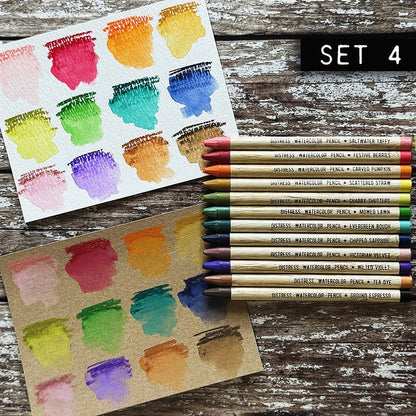 Woodless Watercolour Pencils in Distress colours, set 4 ... by Tim Holtz and Ranger. 12 (twelve) woodless watercolour pencils in Saltwater Taffy, Festive Berries, Carved Pumpkin, Scattered Straw, Shabby Shutters, Mowed Lawn, Evergreen Bough, Chipped Sapphire, Victorian Velvet, Wilted Violet, Tea Dye, Ground Espresso. One of each colour, approx 5" long. Photo of Tim Holtz's swatches with the 12 pencils.