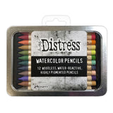 Woodless Watercolour Pencils in Distress colours, set 4 ... by Tim Holtz and Ranger. 12 (twelve) woodless watercolour pencils in Saltwater Taffy, Festive Berries, Carved Pumpkin, Scattered Straw, Shabby Shutters, Mowed Lawn, Evergreen Bough, Chipped Sapphire, Victorian Velvet, Wilted Violet, Tea Dye, Ground Espresso. One of each colour, approx 5" long. Photo of the closed tin with label.