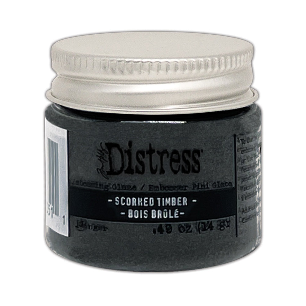 photo of Scorched Timber, image of the packaging, available at Art by Jenny online in Australia. Distress Embossing Glaze by Tim Holtz and Ranger. Distress Embossing Glaze is a fine embossing powder that once melted with a heat tool, creates a colourful tinted semi translucent and slightly textured glazing effect (like a varnish or enamel). Ideal for lettering, stamped images, stenciled areas, abstracts, backgrounds, cardmaking, mixed media, visual arts.