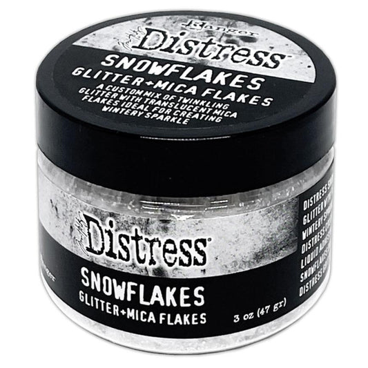 Snowflakes - Mica Flakes and Sparkly Dry Glitter ... by Tim Holtz Distress and Ranger. 3fl oz (88.7ml) jar. Made by Ranger. Tim Holtz Distress® Snowflakes combines a custom mix of twinkling glitter with translucent mica flakes for a nostalgic wintery sparkle.  Adhere Snowflakes with Distress Collage Medium, Ranger Glossy Accents, or other liquid adhesives.