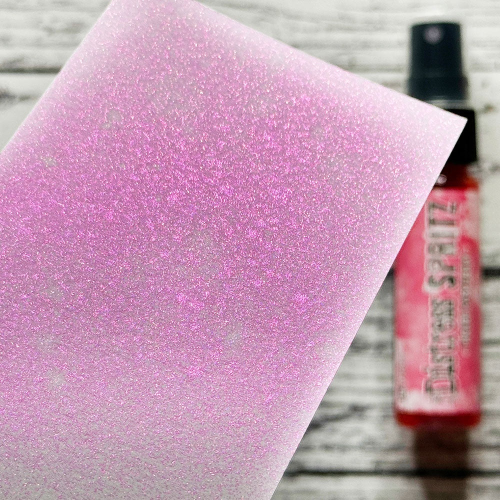 swatch of Picked Raspberry - Distress Spritz ... by Tim Holtz and Ranger - a pearlized Distress ink fusion of colourful mica pigment and clear medium to create a shimmery splattery effect on paper and card surfaces. Each bottle contains 1 fl oz (29ml) with a fine sprayer nozzle and easy to hold container. Enjoy adding Distress Spritz shimmery effects with cardmaking, scrapbooking, mixed media and journaling.