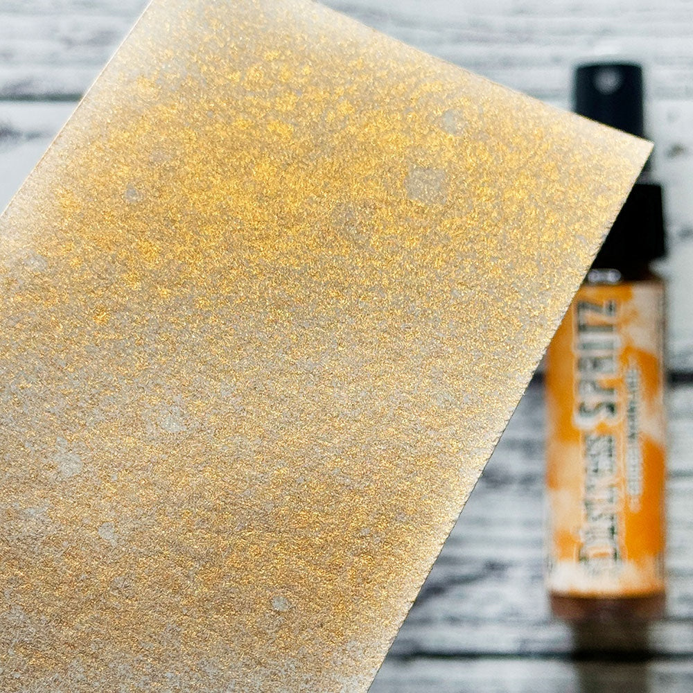 swatch of Spiced Marmalade - Distress Spritz ... by Tim Holtz and Ranger - a pearlized Distress ink fusion of colourful mica pigment and clear medium to create a shimmery splattery effect on paper and card surfaces. Each bottle contains 1 fl oz (29ml) with a fine sprayer nozzle and easy to hold container. Enjoy adding Distress Spritz shimmery effects with cardmaking, scrapbooking, mixed media and journaling.