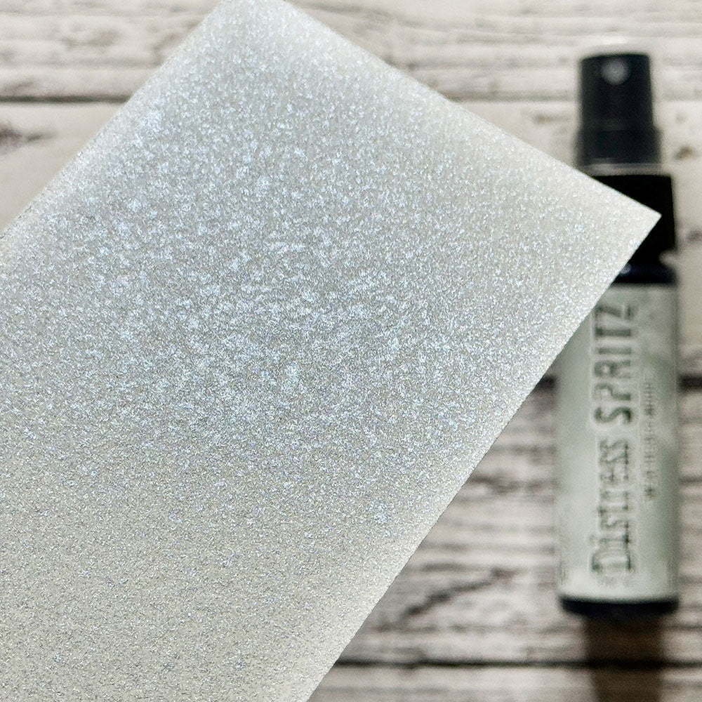 swatch of Weathered Wood - Distress Spritz ... by Tim Holtz and Ranger - a pearlized Distress ink fusion of colourful mica pigment and clear medium to create a shimmery splattery effect on paper and card surfaces. Each bottle contains 1 fl oz (29ml) with a fine sprayer nozzle and easy to hold container. Enjoy adding Distress Spritz shimmery effects with cardmaking, scrapbooking, mixed media and journaling.