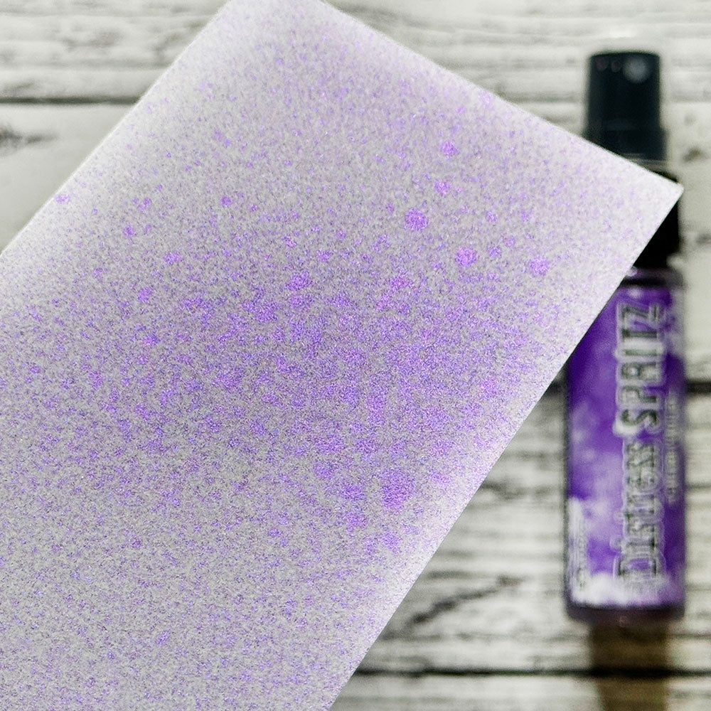 swatch of Wilted Violet - Distress Spritz ... by Tim Holtz and Ranger - a pearlized Distress ink fusion of colourful mica pigment and clear medium to create a shimmery splattery effect on paper and card surfaces. Each bottle contains 1 fl oz (29ml) with a fine sprayer nozzle and easy to hold container. Enjoy adding Distress Spritz shimmery effects with cardmaking, scrapbooking, mixed media and journaling.