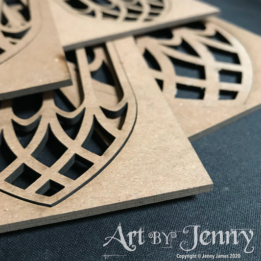 Cathedral Windows - Etcetera by Tim Holtz ... Thickboard artboards with cutout leadlight patterns on an arched shape with rectangle frame. Ideal to use for decorative elements, altering and creating visual arts. Set comprises of 4 (four) small windows, 2 (two) large windows, each 3mm thick, overall base is 4 1/2" x 6 3/4". Total of 6 (six) pieces. Made by Stampers Anonymous with Tim Holtz. THETC015. Photo closeup view of the edges.