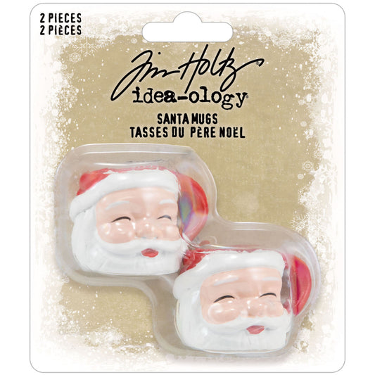 Santa Mugs - Idea-Ology Resin Models ... by Tim Holtz - Miniature dimensional Father Christmas mugs made of resin for decor, assemblage projects, diorama, off-the-page marvels and party decor. Pack of 2 (two) mugs. Each mug is shaped into the face of Santa Claus with beard, jolly happy face and a red handle. Santa Mugs are fantastic to use with your next craft project. Coat it with a sparkly stardust using Distress Dry Glitter (clear, chunky), Twinkle Texture Paste, or grunge it up with Distress.