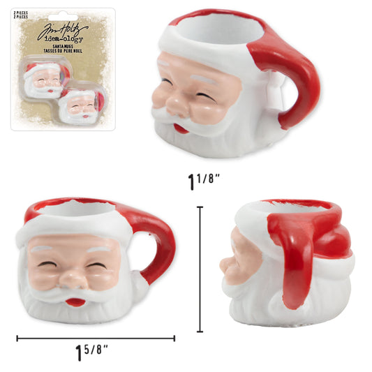 Santa Mugs - Idea-Ology Resin Models ... by Tim Holtz - Miniature dimensional Father Christmas mugs made of resin for decor, assemblage projects, diorama, off-the-page marvels and party decor. Pack of 2 (two) mugs. Each mug is shaped into the face of Santa Claus with beard, jolly happy face and a red handle. Santa Mugs are fantastic to use with your next craft project. Coat it with a sparkly stardust using Distress Dry Glitter (clear, chunky), Twinkle Texture Paste, or grunge it up with Distress. Sizes.