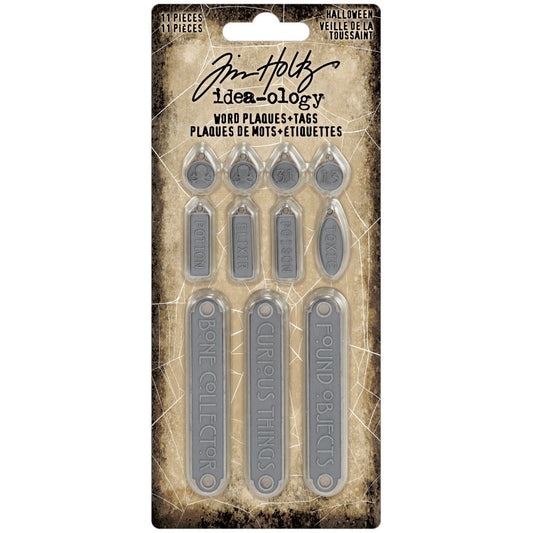 Word Plaques and Tags ... Idea-Ology Metal Adornments by Tim Holtz ... variety of symbols and words on little metal pewter (antique silver) coloured tags (round, rectangle, oval) and plaques (long banners) to use with mixed media, cardmaking, papercraft, scrapbooking and visual arts. 11 (eleven) designs (one of each). Sizes from 6mm wide to 60mm wide.