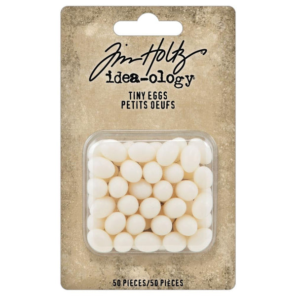 Mini Eggs - Idea-Ology Resin Models by Tim Holtz ... packet of 50 (fifty) miniature realistic shaped eggs to use as baubles, embellishments in mixed media and visual arts, Pack contains : 50 (fifty) pieces. Size : shapes are varied, each is up to approx 7mm x 11mm. Photo of the packaging. TH94304
