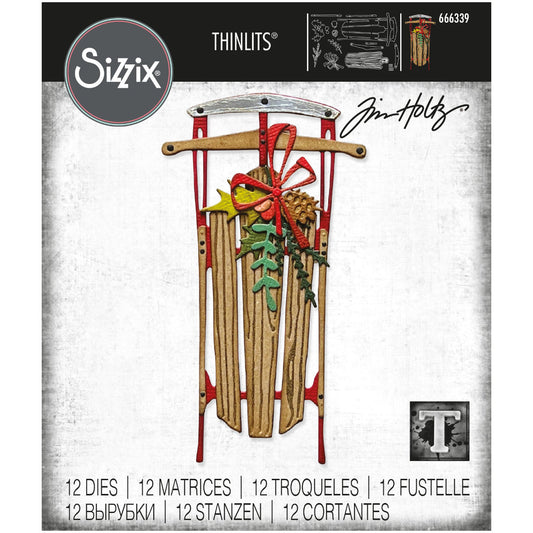 Vintage Sled ... Thinlits Die Cutting Templates by Tim Holtz, made by Sizzix (no.666339). 12 (twelve) dies to cut out a large wooden sled as viewed from above plus a bow, pinecones, foliage, holly leaves and berries.
