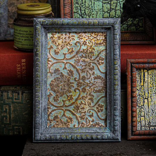 Tapestry - Multi Layered Texture Fades Embossing Folder ... by Tim Holtz and Sizzix (no.666388).    This easy to use dimensional embossing folder creates a beautiful ornate vintage wallpaper pattern over the whole surface of the folder, created with different heights to give fabulous layered effects. Another amazing design from Tim, perfect for cards, journal pages, bookmaking, book covers, papercrafts and visual arts.  Photo of an example in use.