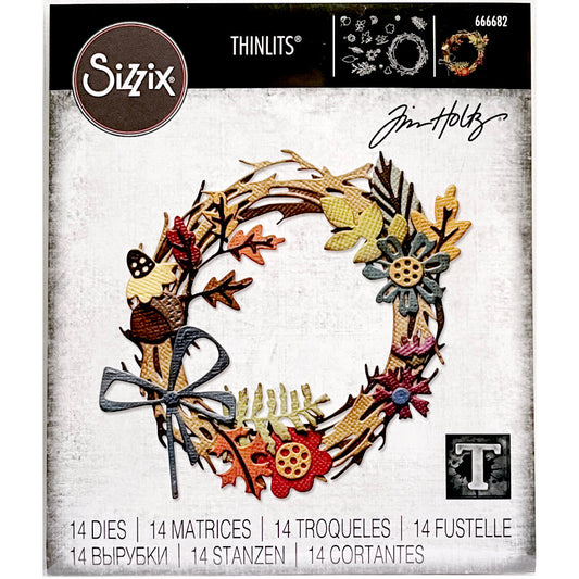 Foliage Wreath - from the Vault ... Thinlits Die Cutting Templates by Tim Holtz, made by Sizzix (no.666682). These 14 (fourteen) dies cut out a large round twiggy wreath, acorns, flowers, variety of leaves and a bow. Brought back to life by Tim and Sizzix, these vintage designs have been reimagined as Thinlits Dies in different sizes to the originals. Sizes (approx) : die cut pieces are from 1/2" x 3/4" (leaf) to 3 3/4" x 3 1/2" (wreath).