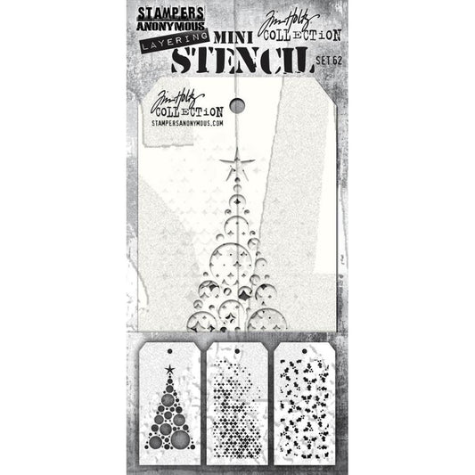 Set 62 - Mini Layering Stencils by Tim Holtz and Stampers Anonymous ... 3 (three) designs (one of each) : Modern Tree, Sparkle Fade, Tiny Holly - Use to create patterns and textures to all kinds of mixed media, visual arts and paper crafts. Overall tag size is 8cm x 16cm (THMS062). 
Modern Tree is a stylish triangular tree made of circles and a star.
- Sparkle Fade ... such pretties, sparkly diamonds from small to tiny.
- Tiny Holly ... more pretties, tiny sprigs of holly and berries.