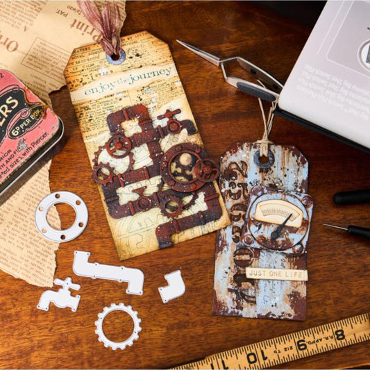Industrial - Sizzix Thinlits die cutting templates by Tim Holtz. 37 (thirty seven) assorted patterns and shapes for a complete steampunk makeover including vintage lightglobe, gauge or dial, gears, numbers, pipes and corners, tap, drip, round washer, arrow bolt tops and more (no.666874). Photo of tag ideas.