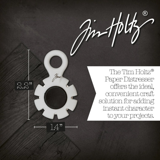Paper Distresser - by Tim Holtz and Tonic Studios ... this is a tool for roughing up paper, cardstock edges and cutting threads in papercrafts, mixed media and tactile crafts. Includes a Kushgrip holder, hanging loop and 7 sharp recessed edges. Ergonomic Kushgrip round centre spot for comfort during handling, with very sharp steel blades recessed within the grey round plastic surround. It is safe to hold and easy to use. Photo from Tonic Studios of size.