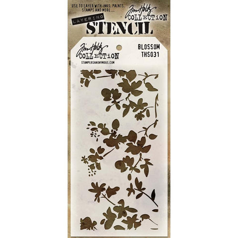 Tim Holtz layering stencil. Pretty fronds of flowers and leaves with what could easily be a little bird perched on a branch.