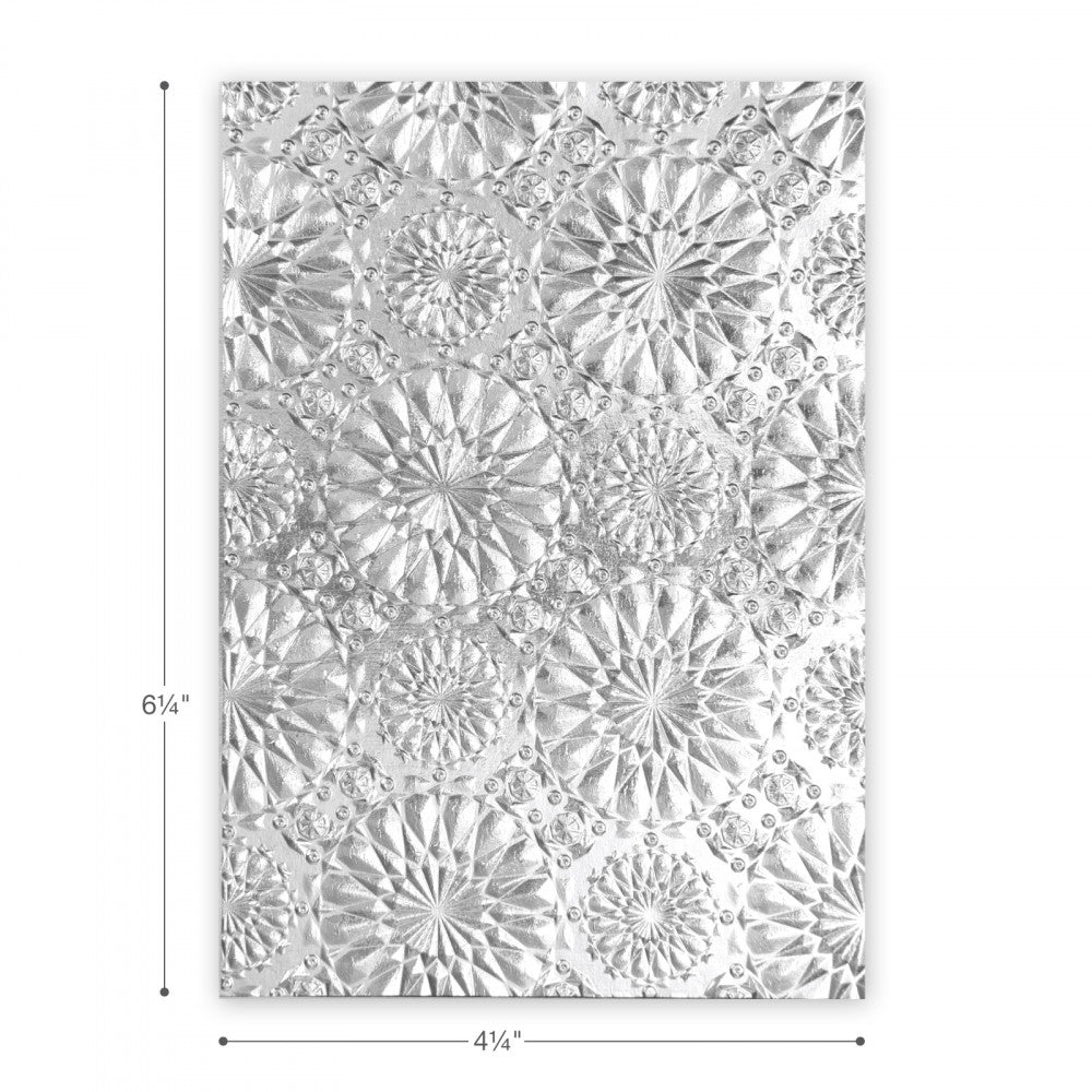 Kaleidoscope - 3D Texture Fades Embossing Folder ... by Tim Holtz and Sizzix (no.663296). Use to create multi-dimensional patterns in paper and cardstock for mixed media, papercrafts and visual arts. Embossing folder (approx) 4 1/4" x 6 1/4" in size. Kaleidoscope is a beautiful design featuring a detailed pattern inspired by the never ending pictures inside the kaleidoscope... flowery mandala starry splashes... the image says it all.