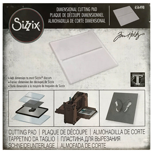 Dimensional Cutting Pad ... by Tim Holtz and Sizzix. Clear plastic cutting plate with a narrow slot used to enable cutting out interactive layers so they stay attached without the use of glues or adhesives. Size 6 1/8" x 6 1/8" pad, 3mm thick. Use this useful and simple device to cut out wings, leaves, tabs, labels and other shapes, and turn them into an interactive element, quickly and easily. Cut out your shapes so they lift off the page and stay put at the same time, no tape or glues required!
