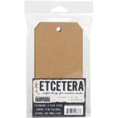 Etcetera Thickboard Tags, Size no.8 - by Tim Holtz and Stampers Anonymous. Pack of 5 (five) tags and 5 (five) rings, each tag is 6 1/4" x 3". Tim Holtz Etcetera Thickboard is a kraft brown hardboard substrate, a 2-3mm thick wood-like material used for mixed media. Etcetera tags are made with compressed paper, made to have the look and feel of mdf or craftwood. image of the pack