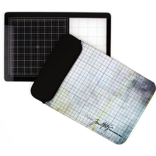 the Tim Holtz Travel Sized Glass Media Mat with a protective sleeve pouch by Tonic Studio
