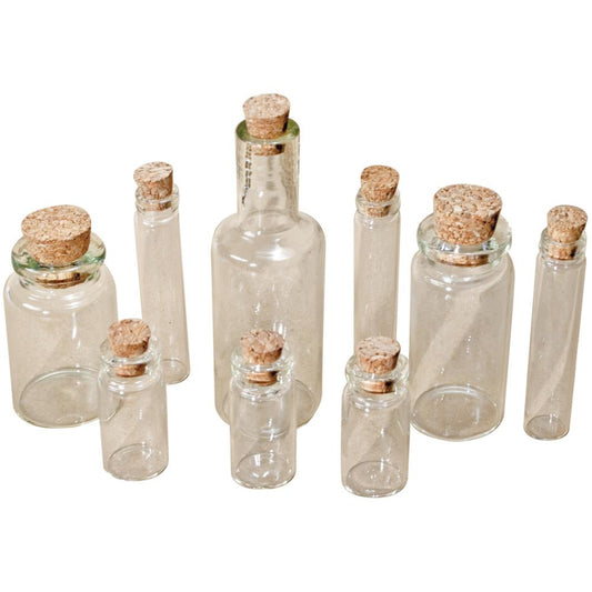 example of Glass Vials with Corks ... by Tim Holtz Idea-Ology - Use for mixed media, assemblage projects, off-the-page marvels and party decor. Pack of 9 (nine) glass bottles with cork lids. Four different shaped bottles, sizes vary from 1 1/4" to 3" high.  Add to your project, off-the-page marvel, canvas or other artistic creation and attach using trimmings, fasteners or collage medium. Alter using alcohol inks, texture pastes, Distress crayons or Distress paints.