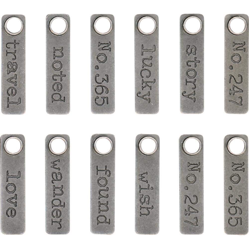 Story Sticks, Metal Adornments by Tim Holtz Idea-Ology displaying words and numbers on short rectangular pendants