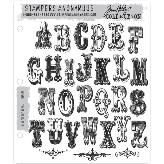 Cirque Alpha (alphabet) Mini ... 29 (twenty nine) rubber stamps by Tim Holtz (CMS079). Letters are approx 1 1/2" high. Set includes 3 (three) decorative scrolls.  This wonderful set of stamps includes all 26 letters of the alphabet and 3 intricate scroll dividers. The illuminated uppercase letters are designed using a style of lettering often used for circuses and carnivals many years ago.