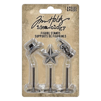 Figure Stands (set 1), Top Hat, Pointing Hand, Dimesional Star ... Idea-Ology Metal Adornments by Tim Holtz ... beautifully detailed silver coloured miniature stands made of metal to use as embellishments for display makes, mixed media, papercraft, scrapbooking and visual arts. 6 (six) pieces (3 figures and 3 stands), standing&nbsp;up to&nbsp;1 1/2" tall.TH94306